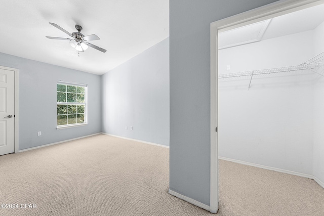 unfurnished bedroom with light carpet and ceiling fan