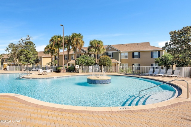 view of swimming pool with a patio area