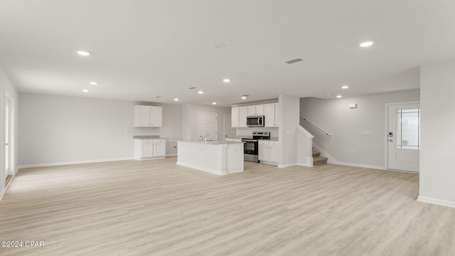 unfurnished living room featuring light hardwood / wood-style flooring