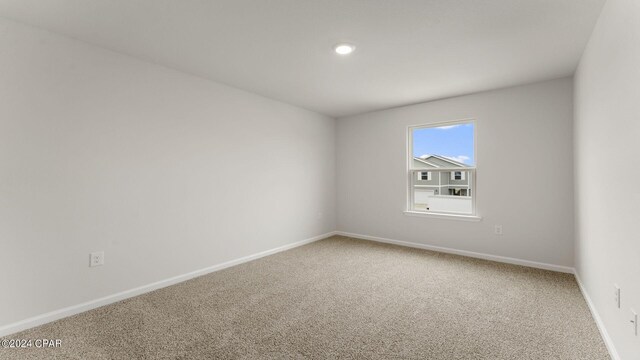 unfurnished room featuring carpet flooring