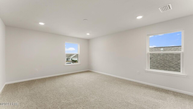 unfurnished room with carpet flooring