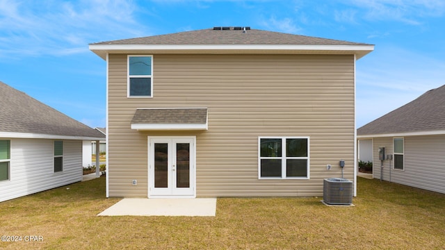 back of house with french doors, a yard, and central air condition unit