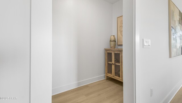 corridor featuring light hardwood / wood-style floors