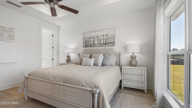 bedroom with ceiling fan and light wood-type flooring