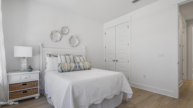 926 Crystal Bayou Blvd, Panama City Beach, FL 32407 - bedroom with a closet, baseboards, and wood finished floors