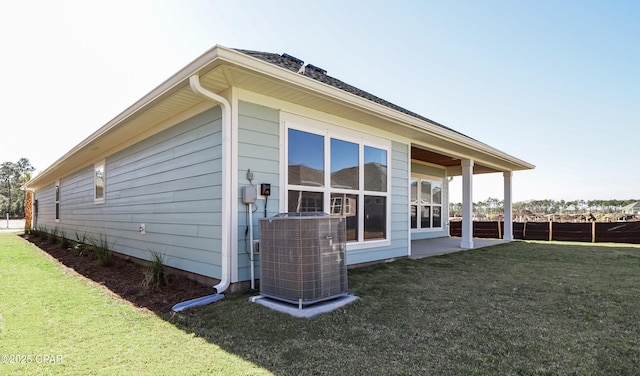 926 Crystal Bayou Blvd, Panama City Beach, FL 32407 - view of side of home featuring cooling unit and a lawn
