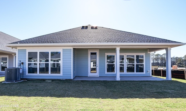 926 Crystal Bayou Blvd, Panama City Beach, FL 32407 - rear view of property featuring a yard, a patio area, a shingled roof, and central AC