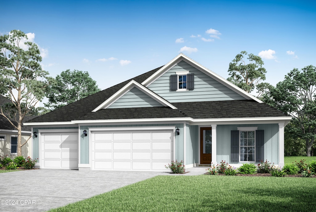 view of front facade with a front lawn and a garage