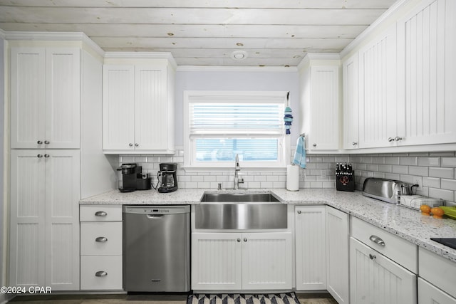 kitchen featuring decorative backsplash, sink, white cabinets, and stainless steel dishwasher