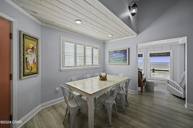 dining area with ornamental molding and dark wood-type flooring