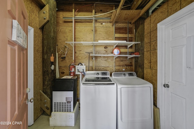 clothes washing area with washing machine and clothes dryer