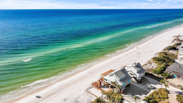 birds eye view of property featuring a water view and a view of the beach