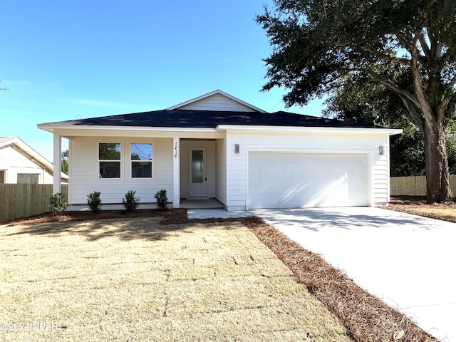 ranch-style home featuring a front yard and a garage