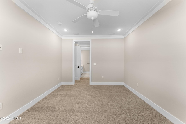 unfurnished room with ceiling fan, ornamental molding, and light carpet