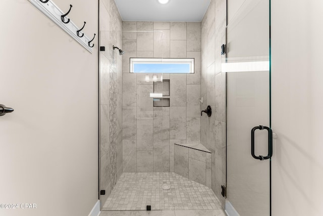 bathroom featuring an enclosed shower