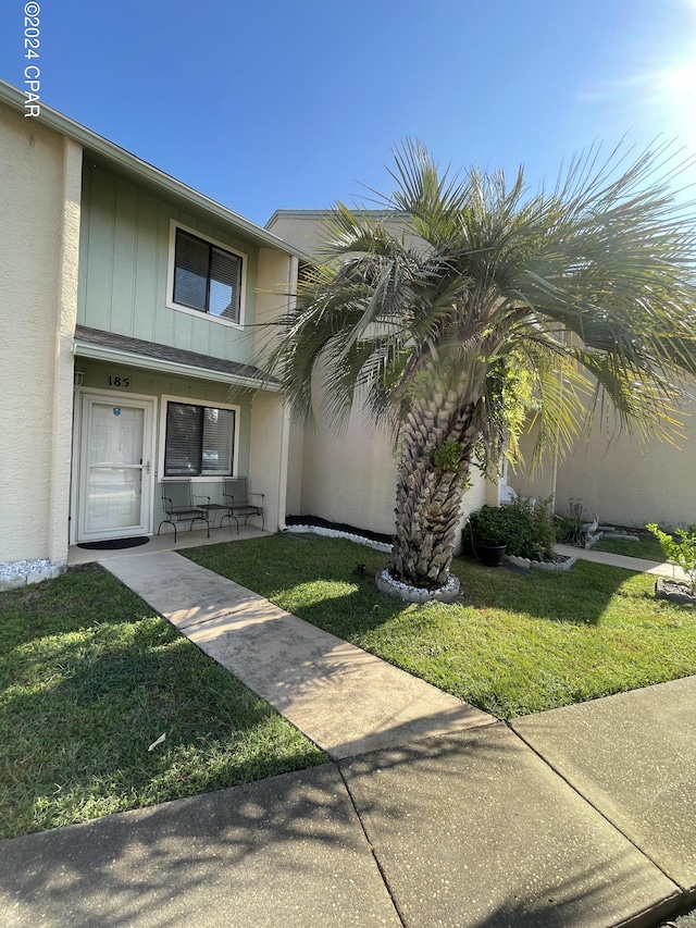 exterior space featuring a front lawn