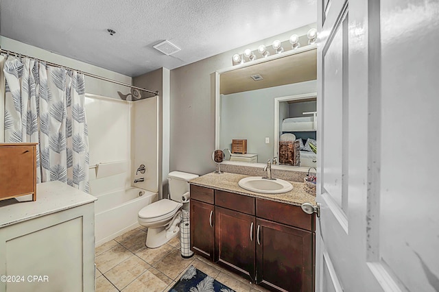 full bathroom with vanity, shower / bath combination with curtain, tile patterned flooring, toilet, and a textured ceiling