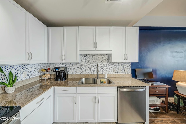 kitchen featuring white cabinets, stainless steel appliances, and sink