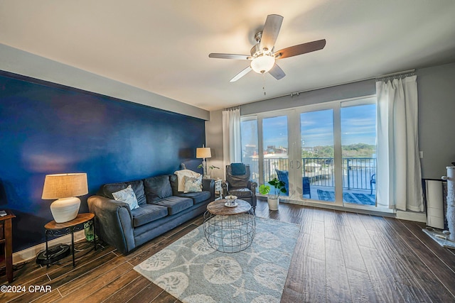 living room featuring french doors, dark hardwood / wood-style floors, and ceiling fan