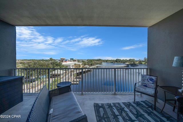 balcony featuring a water view