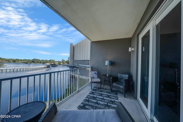 balcony featuring a water view