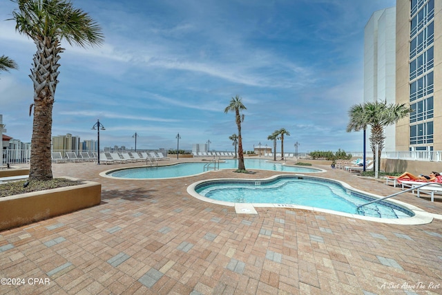 view of swimming pool with a patio area