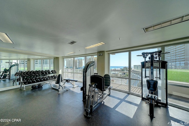 workout area featuring a textured ceiling