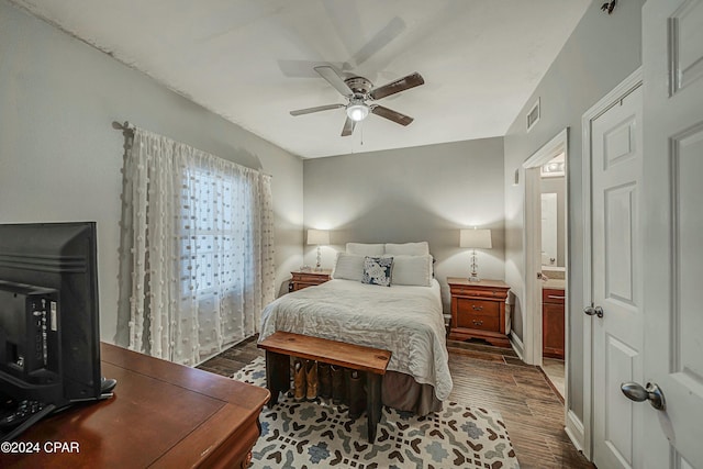 bedroom with dark hardwood / wood-style floors and ceiling fan