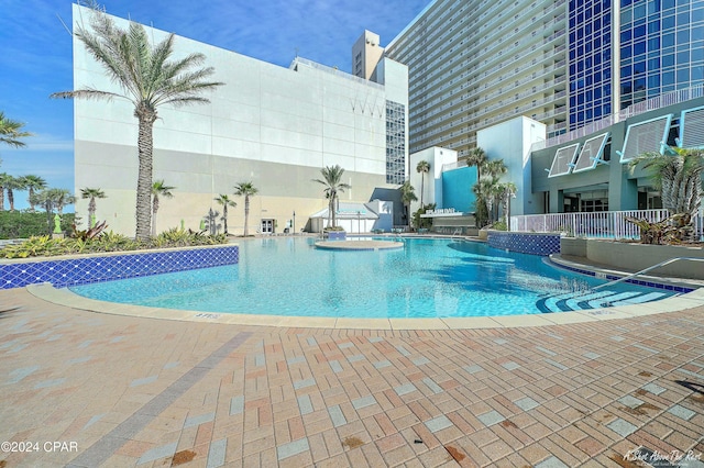 view of swimming pool featuring a patio