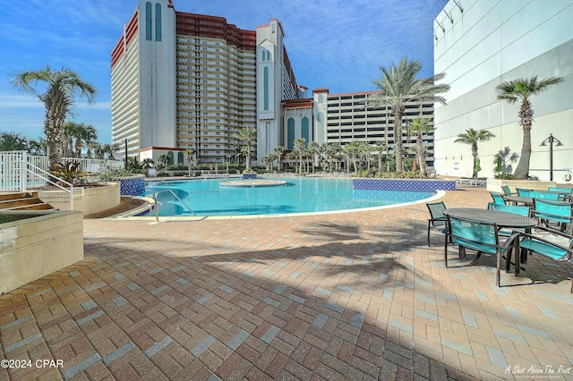 view of swimming pool featuring a patio area