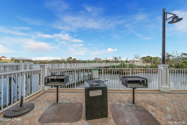 view of patio featuring a water view