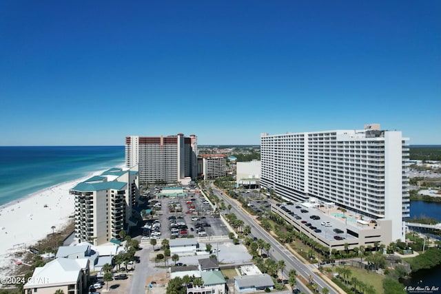 bird's eye view with a water view and a view of the beach