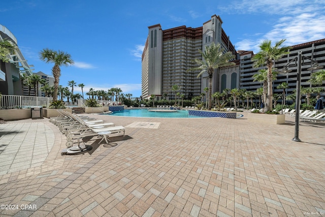 view of swimming pool featuring a patio area