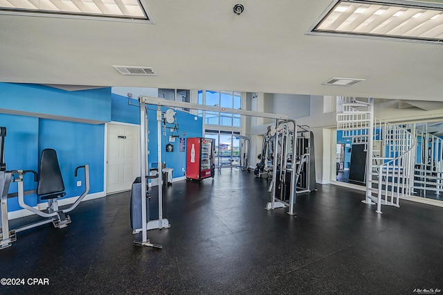 exercise room with a textured ceiling