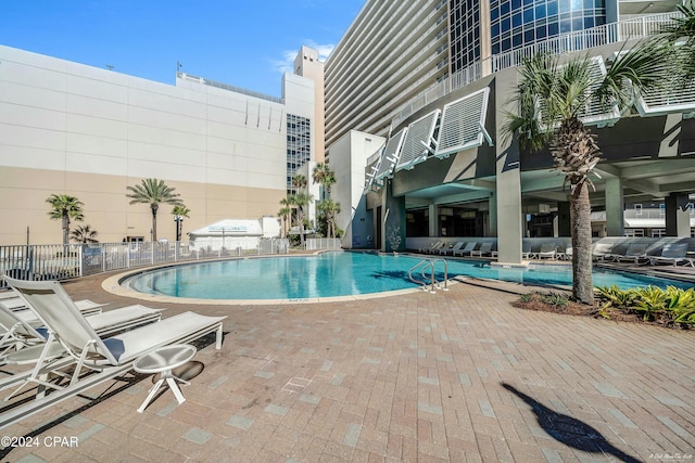 view of swimming pool featuring a patio area