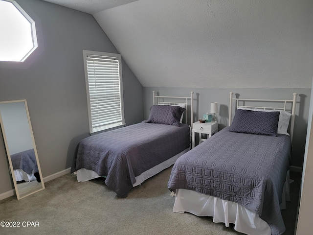 carpeted bedroom with lofted ceiling and a textured ceiling