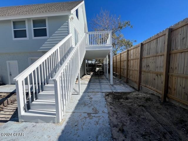 view of side of property with a carport