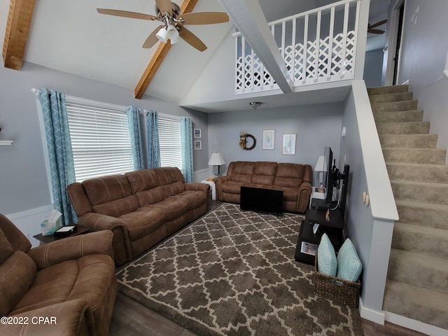 living room featuring ceiling fan, beam ceiling, and dark wood-type flooring