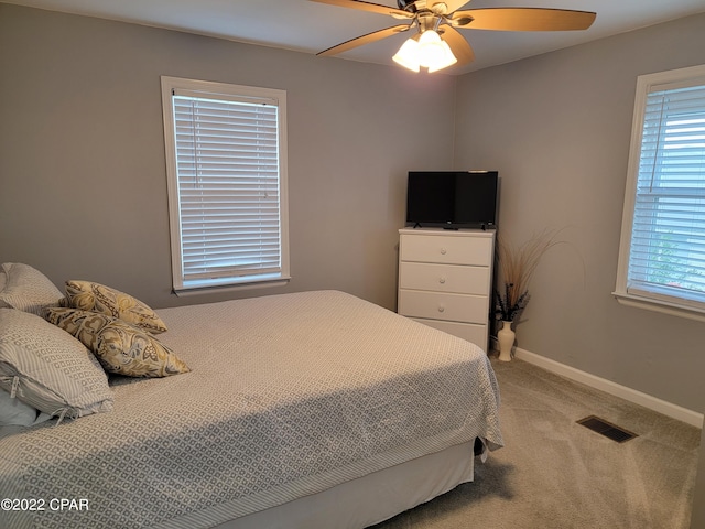 carpeted bedroom featuring ceiling fan