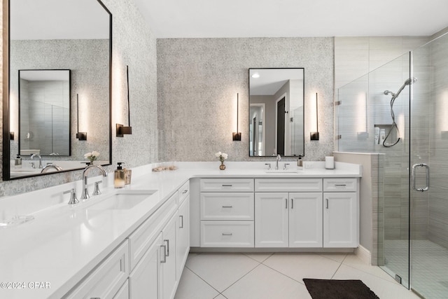 bathroom with tile patterned flooring, vanity, and a shower with door