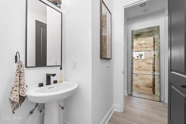 bathroom featuring hardwood / wood-style flooring