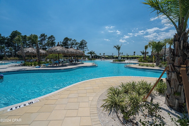 view of swimming pool featuring a gazebo and a patio area