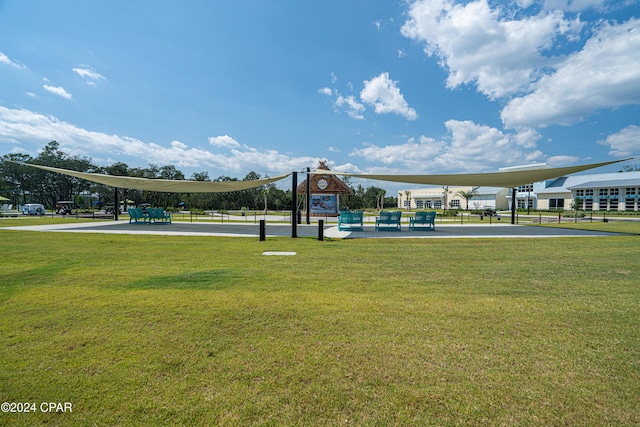 view of home's community with a yard