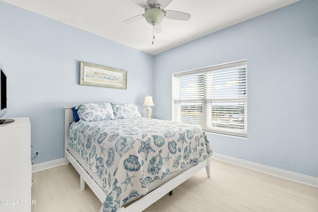 bedroom with ceiling fan and light hardwood / wood-style flooring