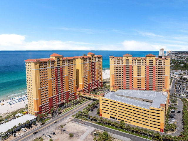 birds eye view of property featuring a view of the beach and a water view