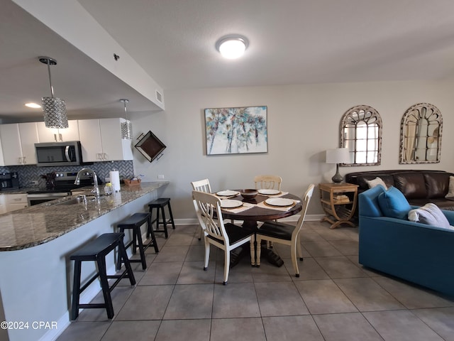 tiled dining space with sink