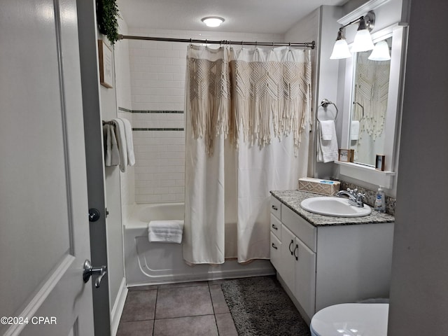 full bathroom featuring tile patterned floors, shower / bath combination with curtain, a textured ceiling, toilet, and vanity