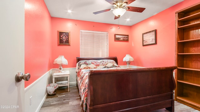 bedroom featuring light hardwood / wood-style flooring and ceiling fan