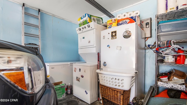 laundry room with stacked washer and clothes dryer