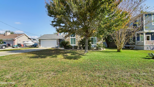 view of front facade with a front yard and a garage